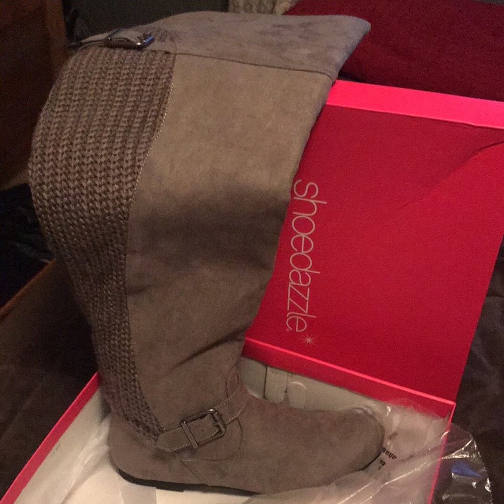 Knee high boots with knit back. Never been worn.